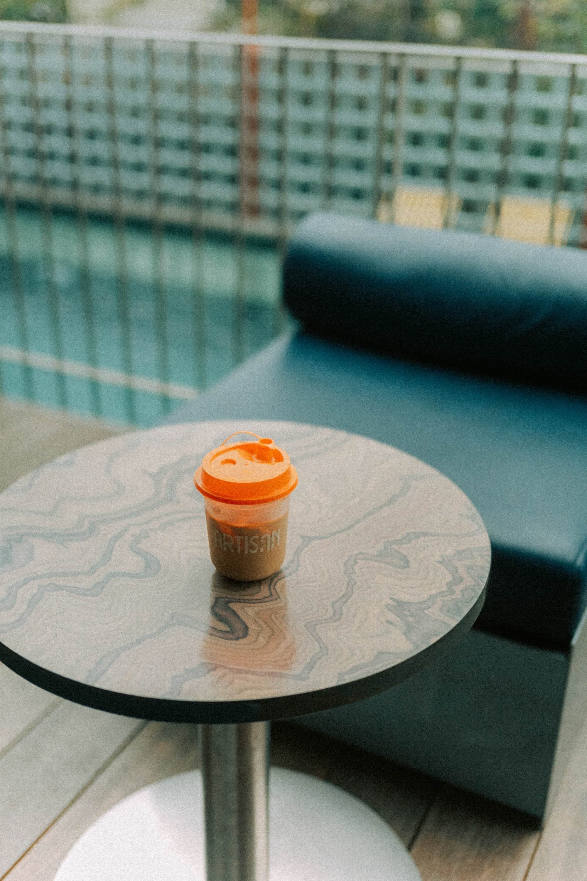 An Artisan coffee on a terrace table