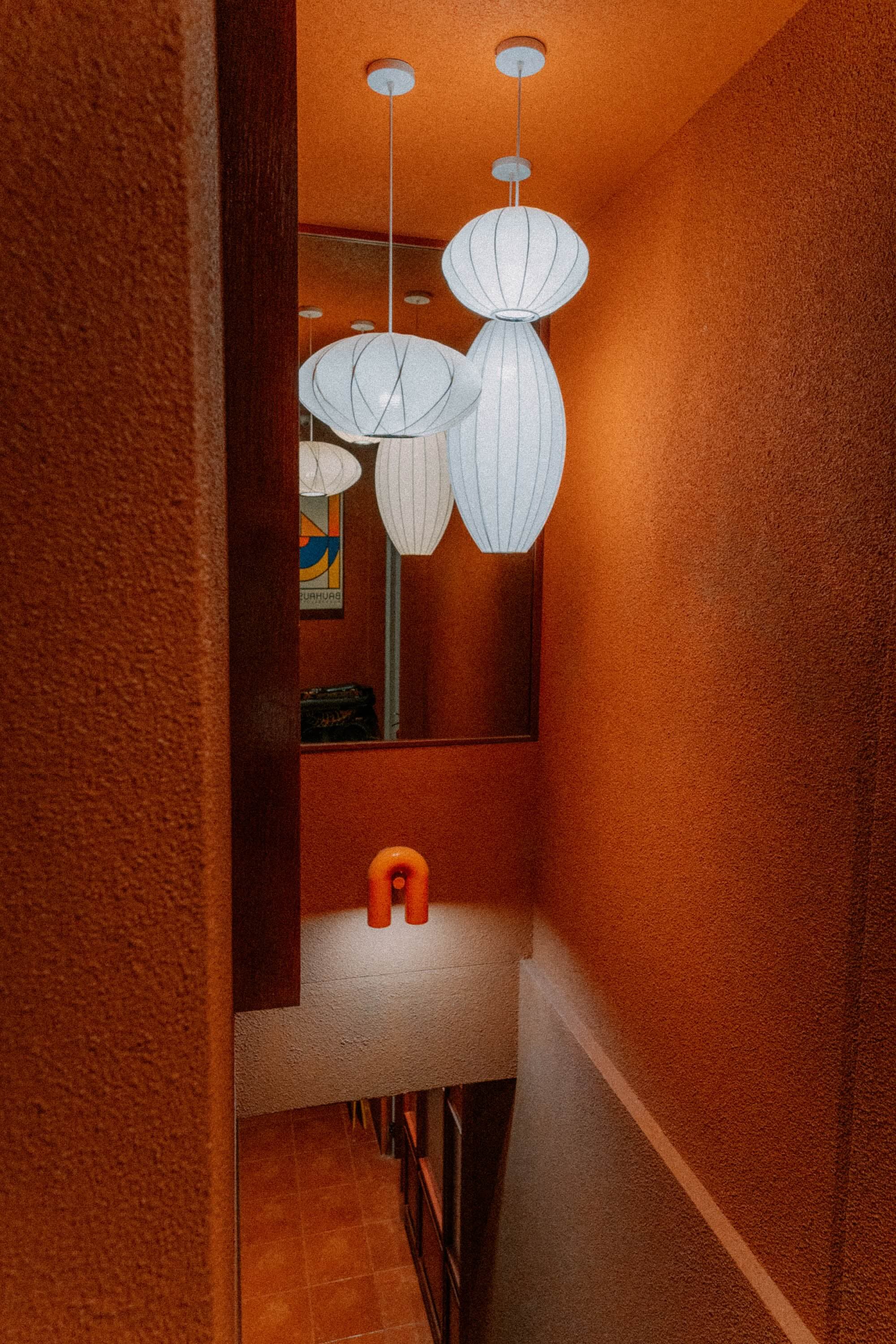 Stairwell with white pendant lamps