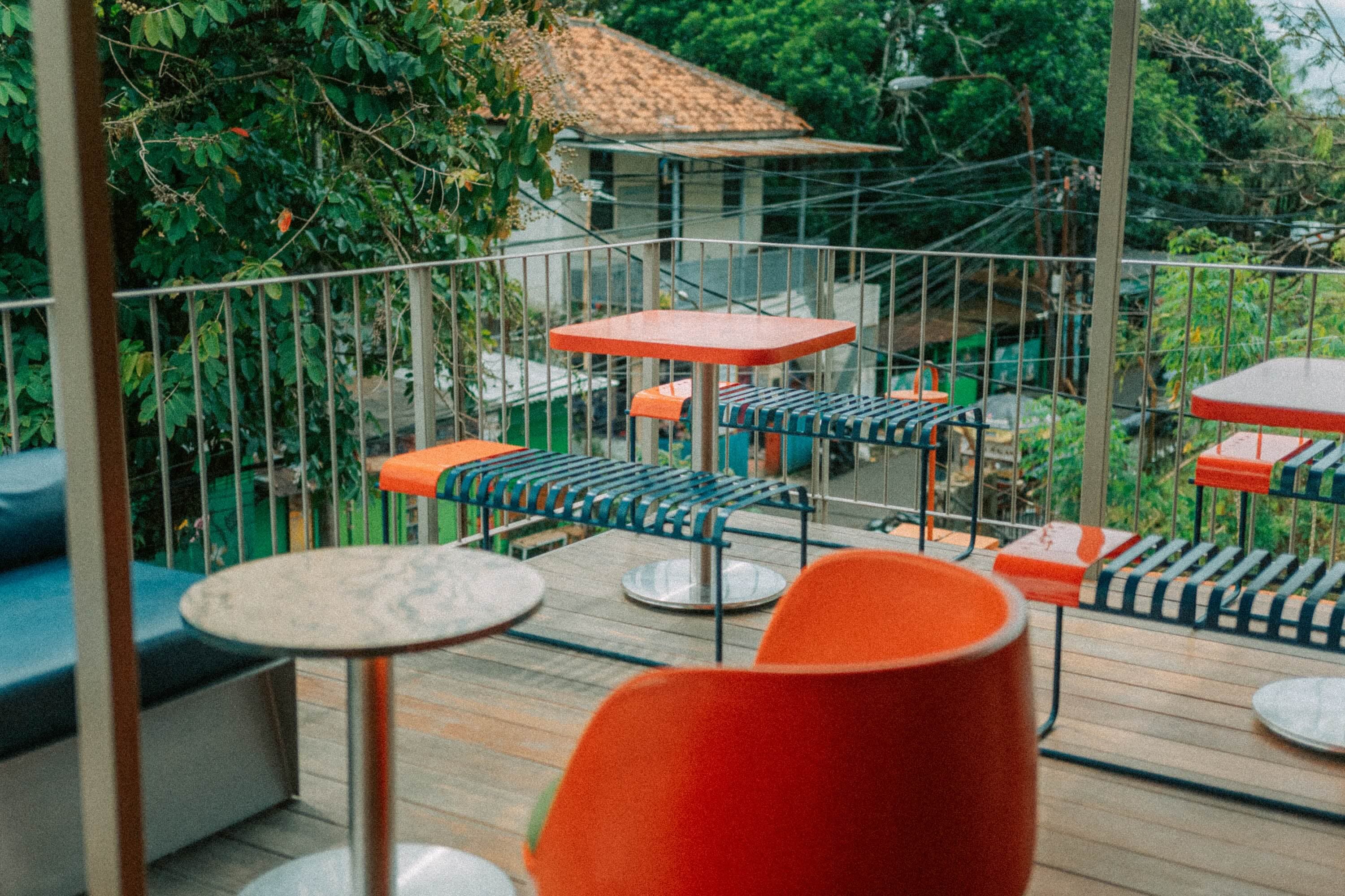 Tables on the Artisan terrace with a green view