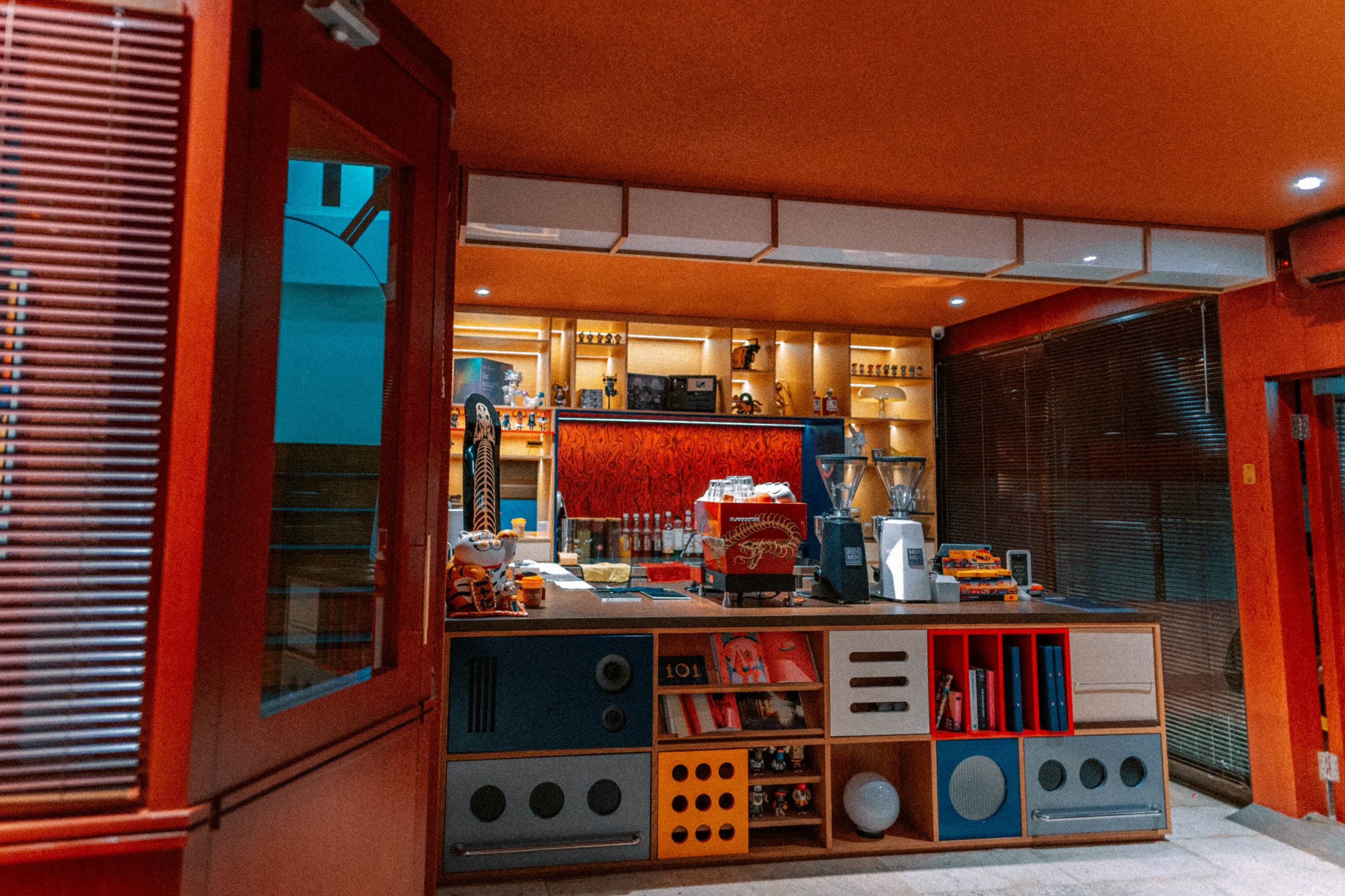 Artisan Coffee bar with display shelves and an espresso machine