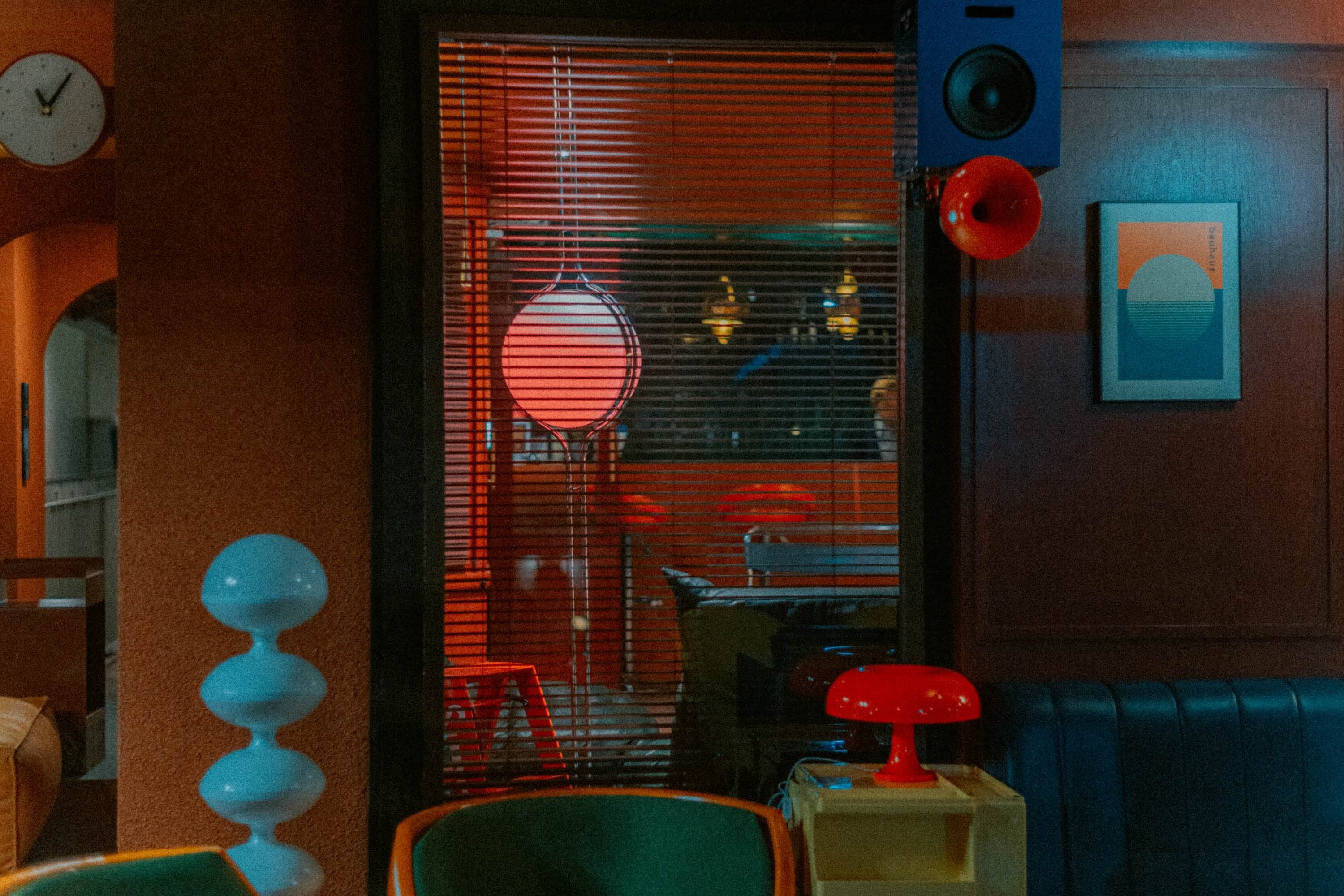 Artisan interior with speakers and a green egg chair